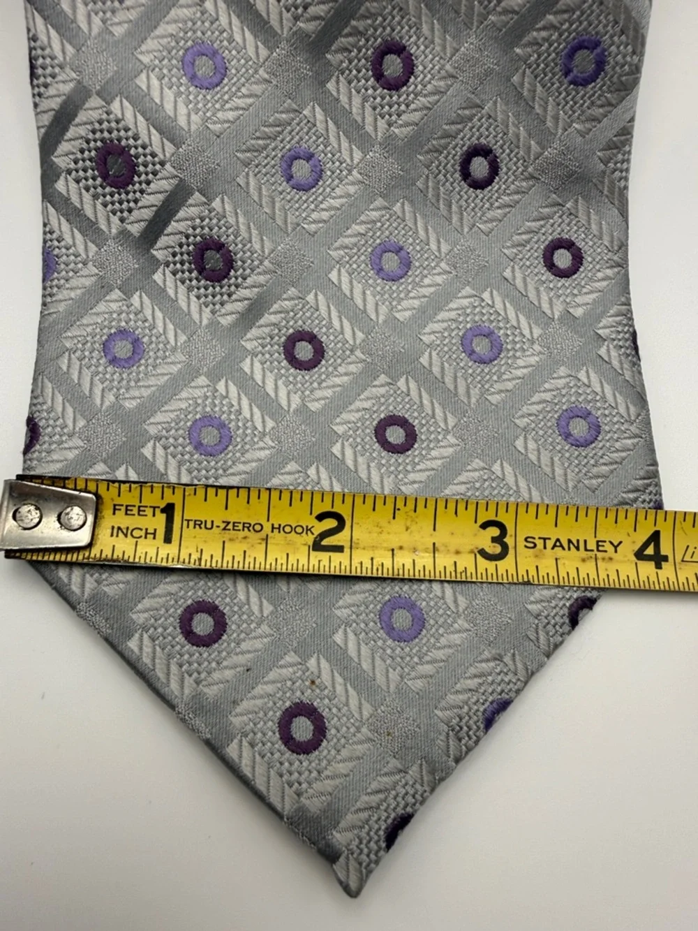 Pierre Cardin tie in a silver and purple geometric pattern. 100% silk.